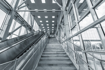Empty escalator and stairs to the railway ticket offices.