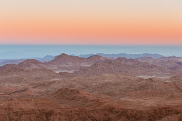 Fototapeta na wymiar Gold sunset arid desert landscape with mountains silhouette Sinai, Egypt