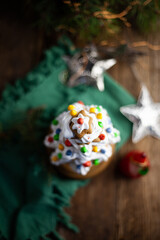 Baked gingerbread christmas tree on wooden background. Close-up