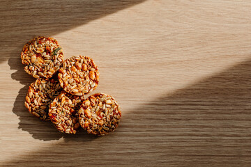  Kozinak cookies made from seeds and nuts on a wooden background. Flat lay, top view, copy space