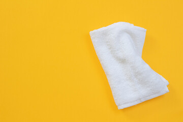 white cleaning towel on yellow background. Duster