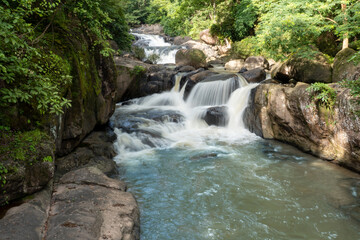 Fototapeta na wymiar Waterfall in forest at Nation park, Nang Rong, Nakhon Nayok, Thailand.