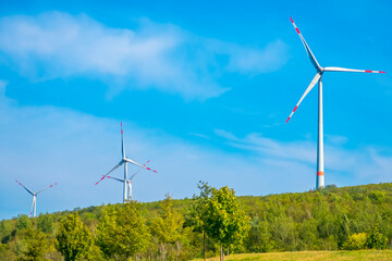 wind turbine on the hill at sunny day