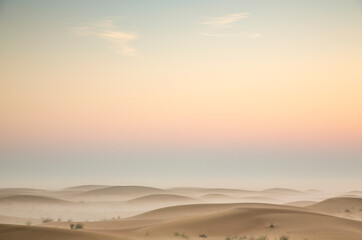 sunrise in a misty desert