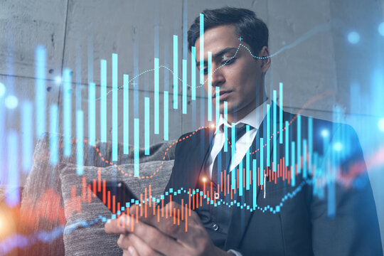 Trader in office working with Smartphone, FOREX graph hologram to analyze market behavior, typing phone. Double exposure.