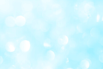 Bokeh light on blue background, sky with circle glitter light blue. Snow abstract soft glowing with vivid bright light and bokeh blur effect. 