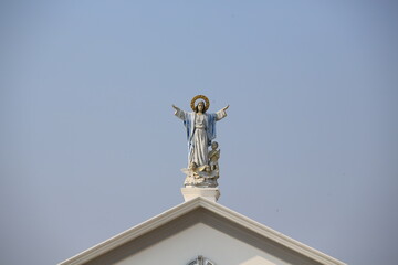 statue of jesus on the top of church in thailand