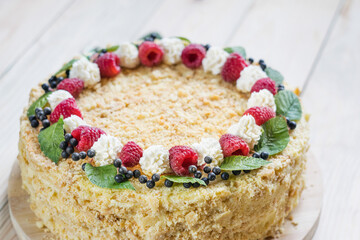 Napoleon cake with raspberries and cream. Selective focus, close-up