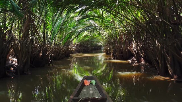Take a boat trip to see palm tree tunnels and traditional lifestyles at Surat thani, Thailand