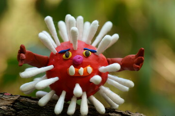 Figure of a virus made of plasticine close-up.