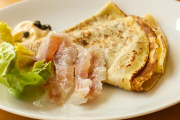 Gravlax with pancake served salad