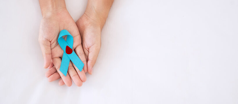 November World Diabetes day Awareness month, Woman holding light Blue Ribbon with blood drop for supporting people living, prevention and illness. Healthcare, prostate cancer day concept - Powered by Adobe