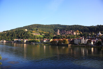 Fototapeta na wymiar View of Heidelberg old town and Castle with the river Neckar during sunset in autumn in Heidelberg, Germany