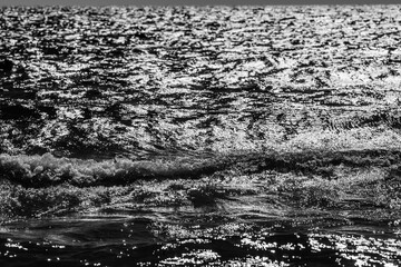 Sea surface with waves. Black and white photography. Raging sea texture