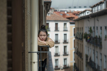 dramatic portrait of young beautiful sad and depressed Asian Japanese woman feeling unhappy and worried suffering some problem going through depression