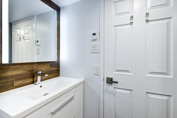 Real estate photography - Beautiful empty renovated apartment in an apartment building with bathroom, new kitchen, new floors, all white painted