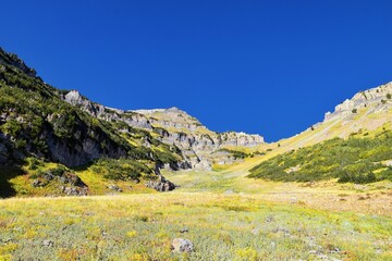 Fototapeta premium Timpanogos hiking trail landscape views in Uinta Wasatch Cache National Forest, around Utah Lake, in the Rocky Mountains in fall. Views of Midway, Heber, Provo city, Salt Lake and Utah County. USA.