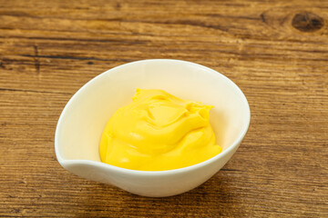 Natural cheese sauce in the bowl