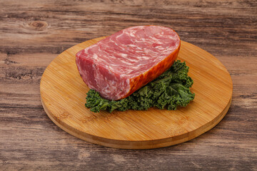 Beef ham piece over board