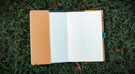 Open notebook on the grass.