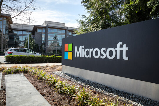 Microsoft headquarters in Redmond, Washington, with commuters in the background, on March 28, 2019