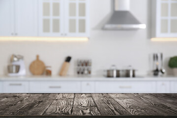 Wooden table in light kitchen. Space for design