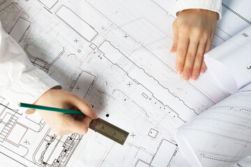Architect working on blueprint. Architects workplace