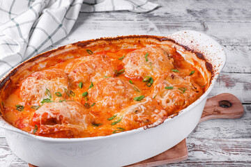 Stuffed peppers with mince roasted with melted cheese in the oven dish