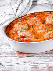 Stuffed peppers with mince roasted with melted cheese in the oven dish