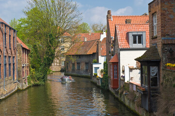 Fototapeta na wymiar Historic centre of Bruges, Canal, Tourist boat, Belgium, Unesco World Heritage Site.