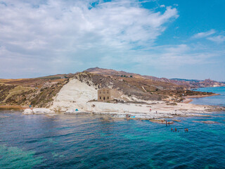 Punta Bianca, Agrigento in Sicily Italy -  White beach with old ruins of abandoned stone house on...