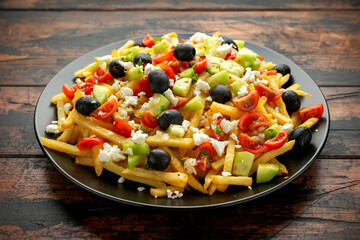 Loaded potato Vegan Fries with tomato, cucumber, olives and feta cheese