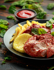 Fried Gammon steak with pineapple, french fries and vegetables