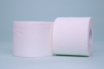 Toilet paper on a green background. Hygiene product.