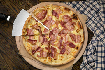 Pizza, in stock. on a brown wooden table.
