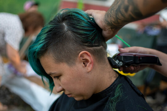 Cutting Hair With Machine To A Woman