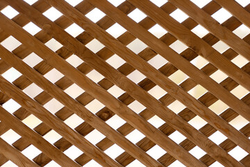 background of wooden slats through which light passes