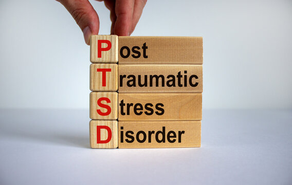 Concept words 'PTSD, post-traumatic stress disorder' on cubes and blocks on a beautiful white background. Copy space.