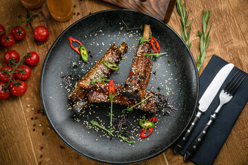 Grilled meat from the menu of an Italian restaurant. On a wooden table
