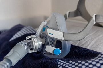 CPAP mask against obstructive sleep apnea on pillow helps patients as respirator mask and headgear...