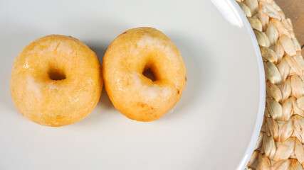 Homemade Mini Donuts with Dughnut maker on side, top view
