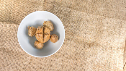 Indonesian meat balls ‘‘bakso” homemade, on white bowl