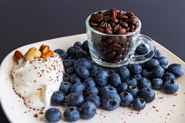 coffee with blueberries yogurt and nuts