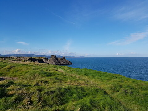 Just The Right Balance Between The Sea, The Green Grass And The Blue Sky