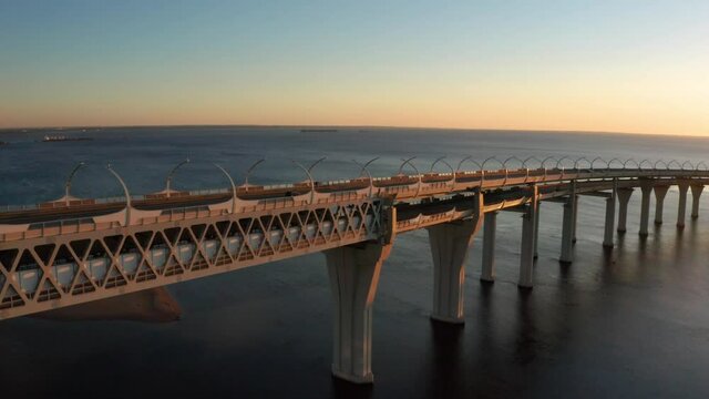 High-speed toll road, highway bypassing the city center St. Petersburg, the central section of the western high-speed section. A beautiful view of the sunset over the Gulf of Finland.