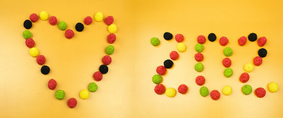 The word sos and the heart are lined with colorful candies