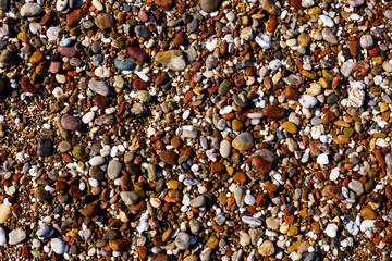 A sunny summer day at sea. Pebble beach. Sea pebbles. Stones. Sea. Beach. The nature of the sea. 