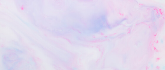 Fluid art texture. Pink blue background from liquid. Photography of colored spots on liquid. Abstract pattern
