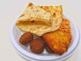 Arabic Food Kuboos And Tamiya In White Plate