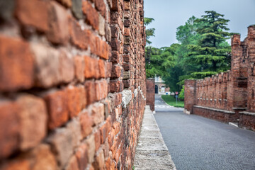 Scaliger bridge in Verona. Brickwork, paving stones. Close up. Selective focus. Verona, Veneto, Italy